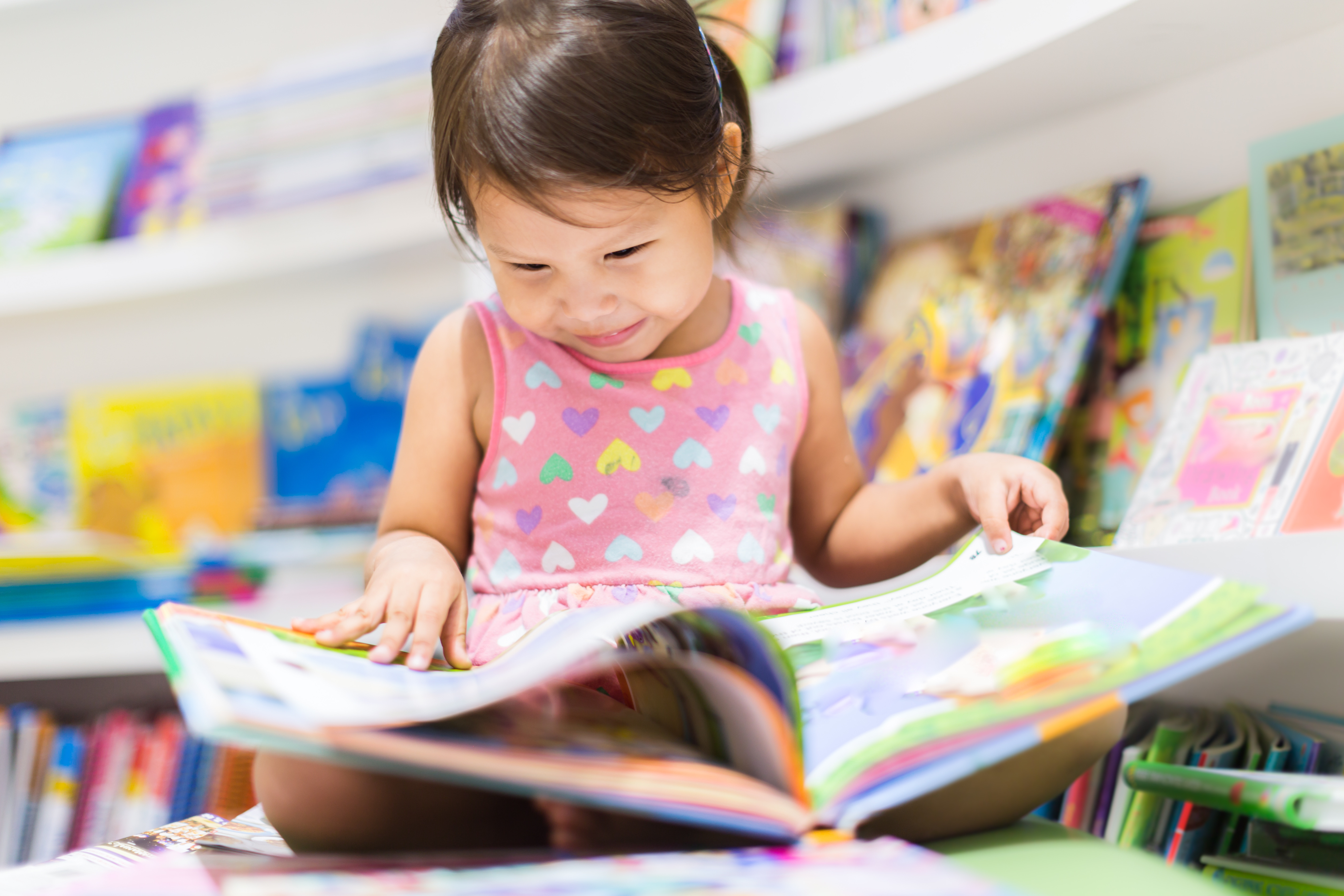 toddler reading picture book