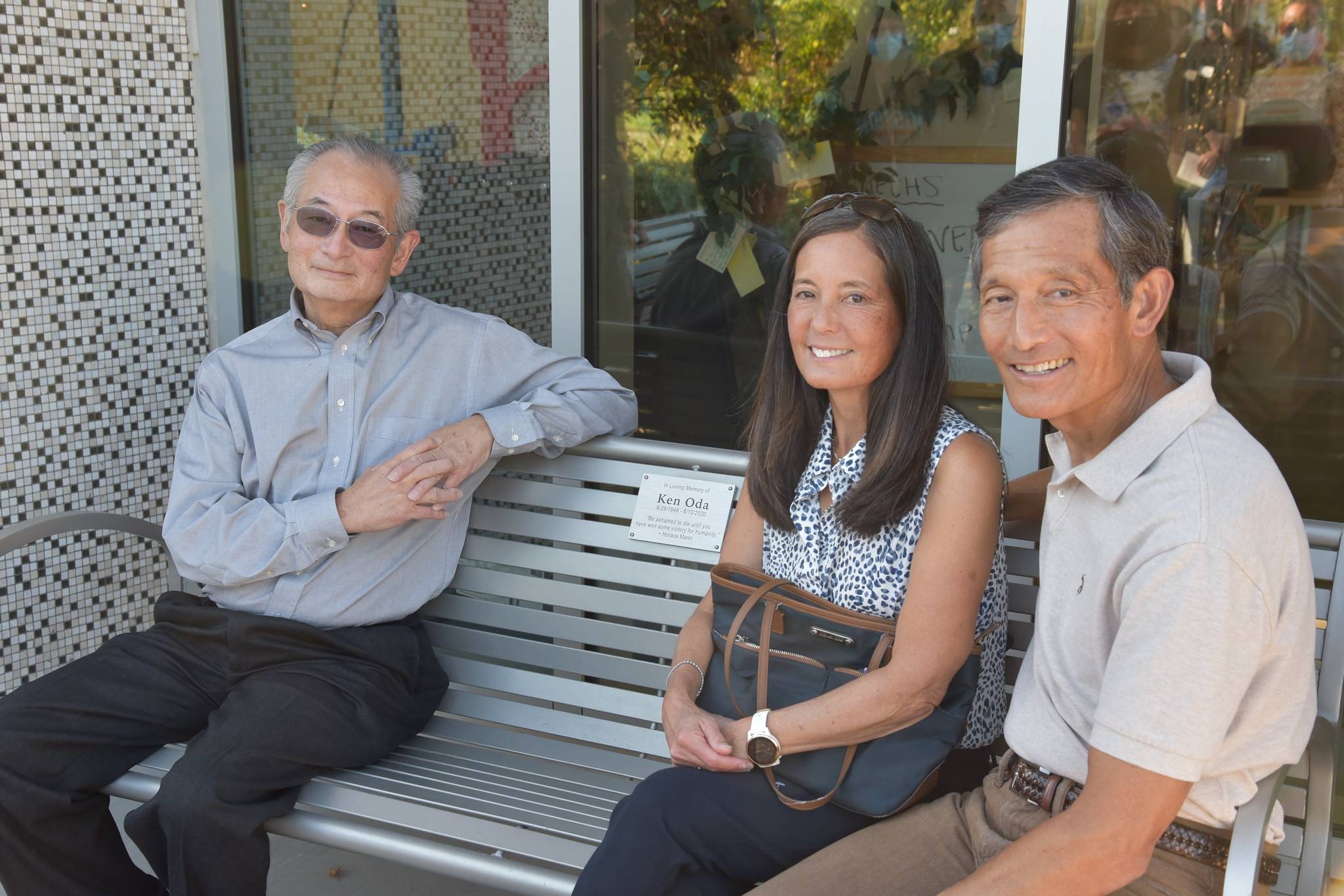 family on bench named after Ken Oda